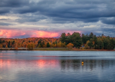 <div class="text-large">lake at sunset with pink sky</div>