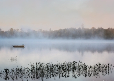 <div class="text-large">canoe on foggy lake</div>